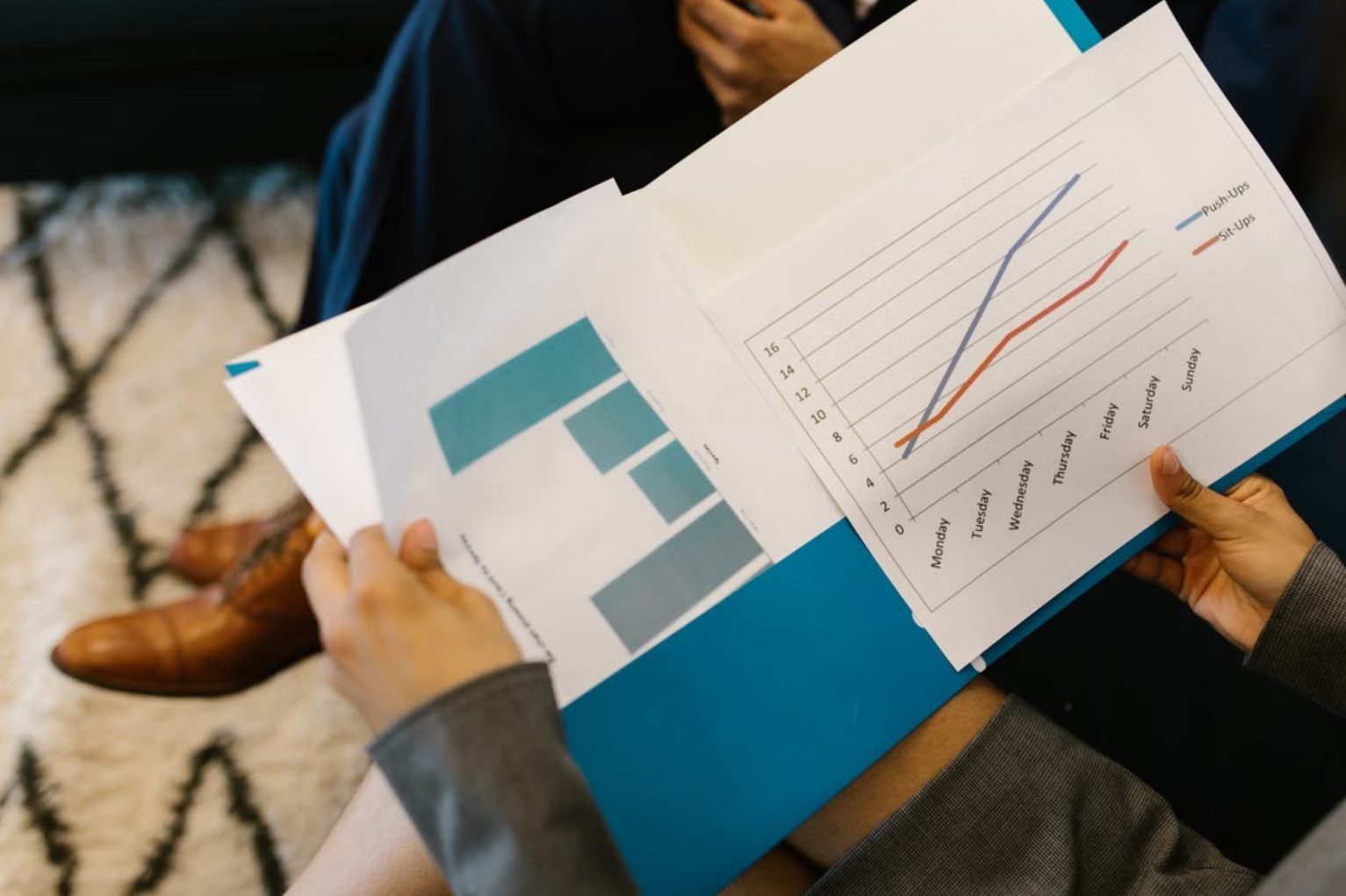 Reviewing financial reports in a meeting
