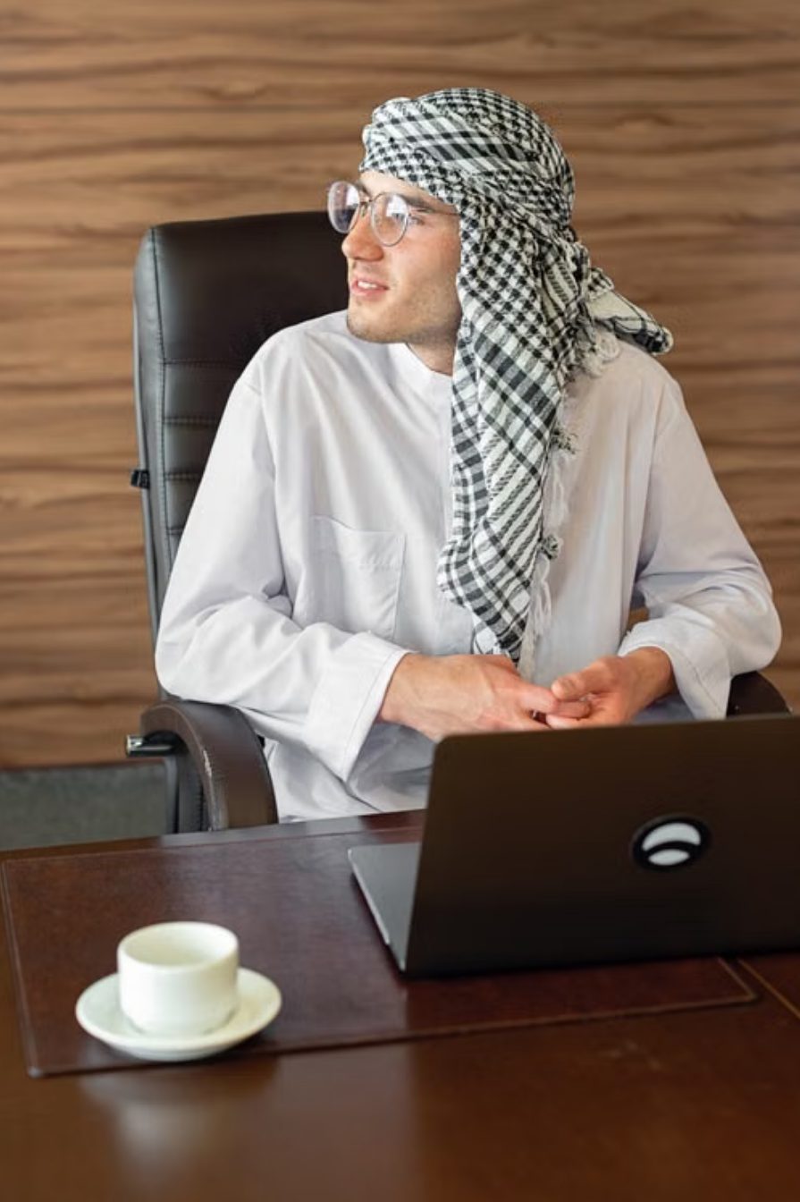 A business owner going over figures at his desk