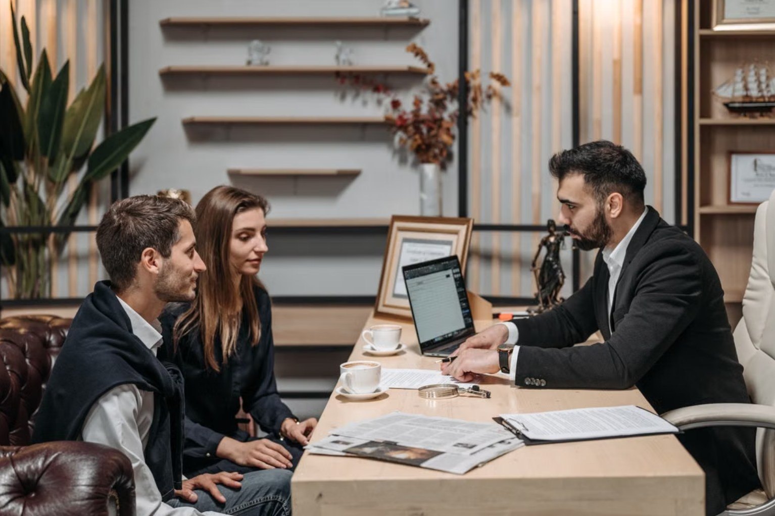 An adviser walking business owners through options at his desk
